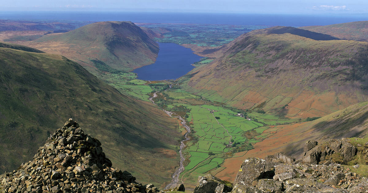 Serene lake and rolling green hills in the Lake District National Park, England